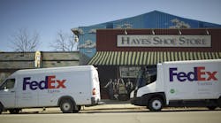 On the left, a conventional FedEx delivery vehicle compared to the eStar electric vehicle on the right. FedEx is testing the eStar in select urban markets.