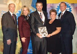 Mark Herman, third from left, accepts his award from Tim Zilke, ASE president and Kristen Davis of Delmar. Second from right is Herman's wife, Janet; at right is Greg Clayton of Delmar. Mark Herman, third from left, accepts his award from Tim Zilke, ASE president and Kristen Davis of Delmar. Second from right is Herman's wife, Janet; at right is Greg Clayton of Delmar.