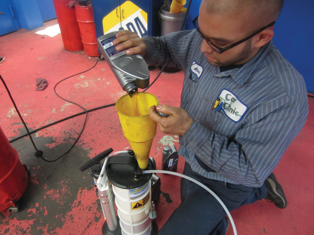 Figure 6: Filling a MityVac fluid extractor with OE transmission fluid for a tranny service one a 2010 VW diesel.