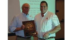 ALI President R.W. (Bob) O&rsquo;Gorman, right, presents a service plaque to outgoing ALI Chairman Douglas Grunnet at the organization&rsquo;s recent annual meeting.