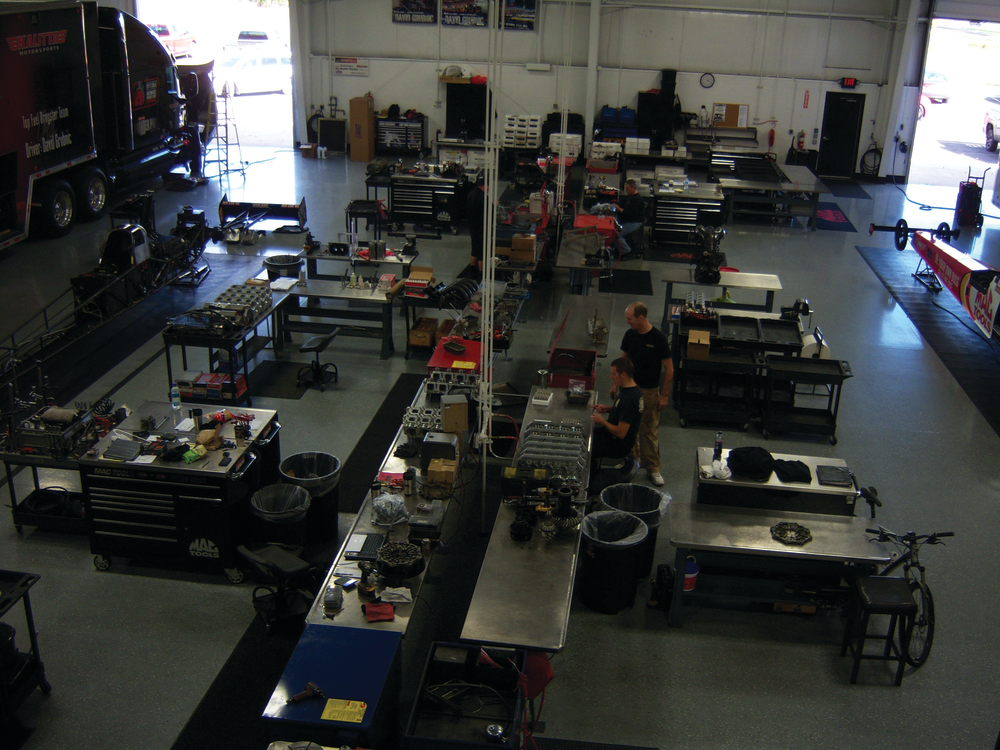 All techs have their own work areas in an open room.