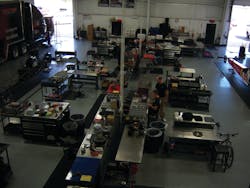 All techs have their own work areas in an open room. All techs have their own work areas in an open room.