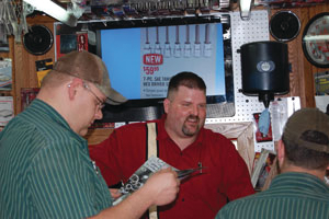 David Musil talking with customers.