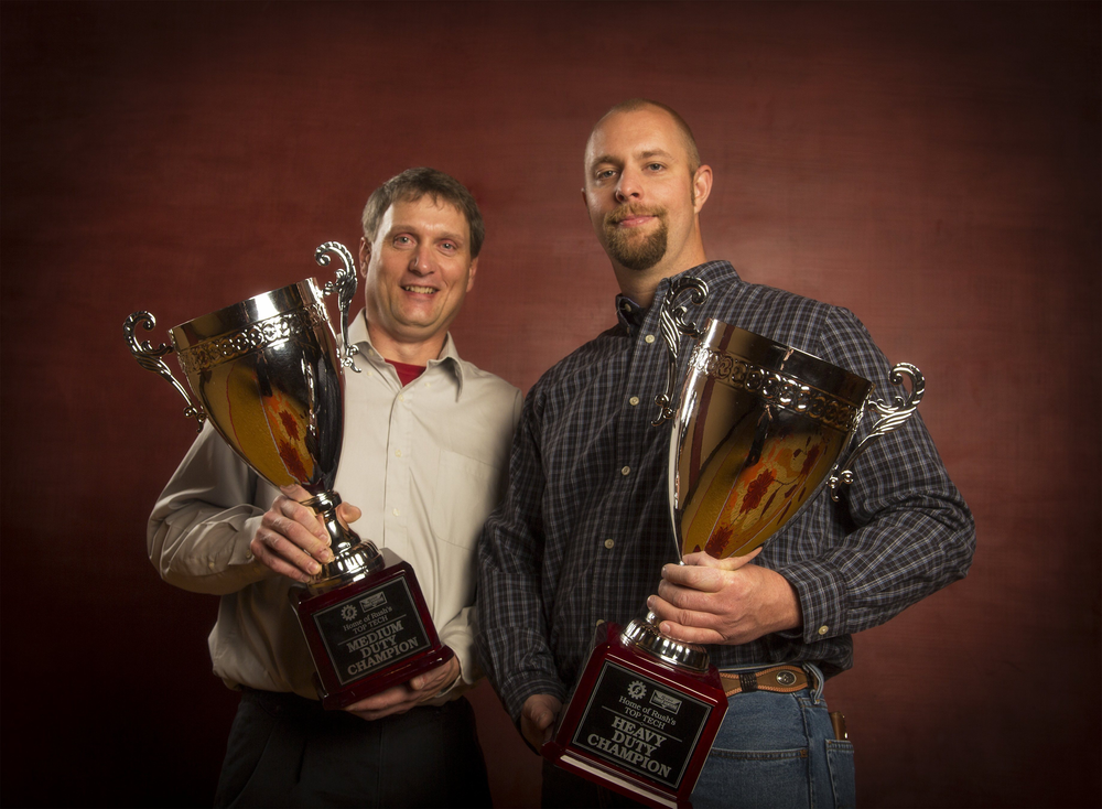 Grand Champions in the Rush Truck Centers Tech Skills Rodeo. Left, medium duty winner, John Dobberpuhl; right, top heavy duty technician, Jason Swann.