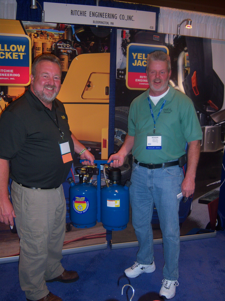 Karl Mathis, left, of Ritchie Engineering shows a Yellow Jacket mobile flushing tool to Roger Smith of Truck Air Service in Columbus, Ga.