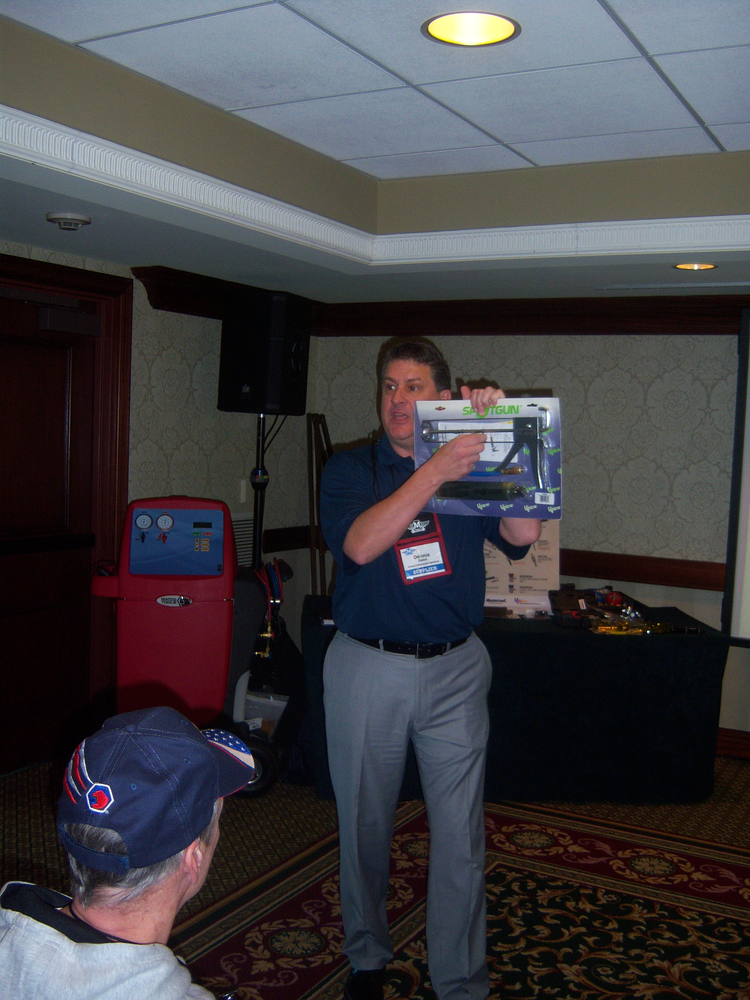 Dennis Eaton talks about Uview's Spotgun injection kit during a seminar at the Matco Tools national business conference.