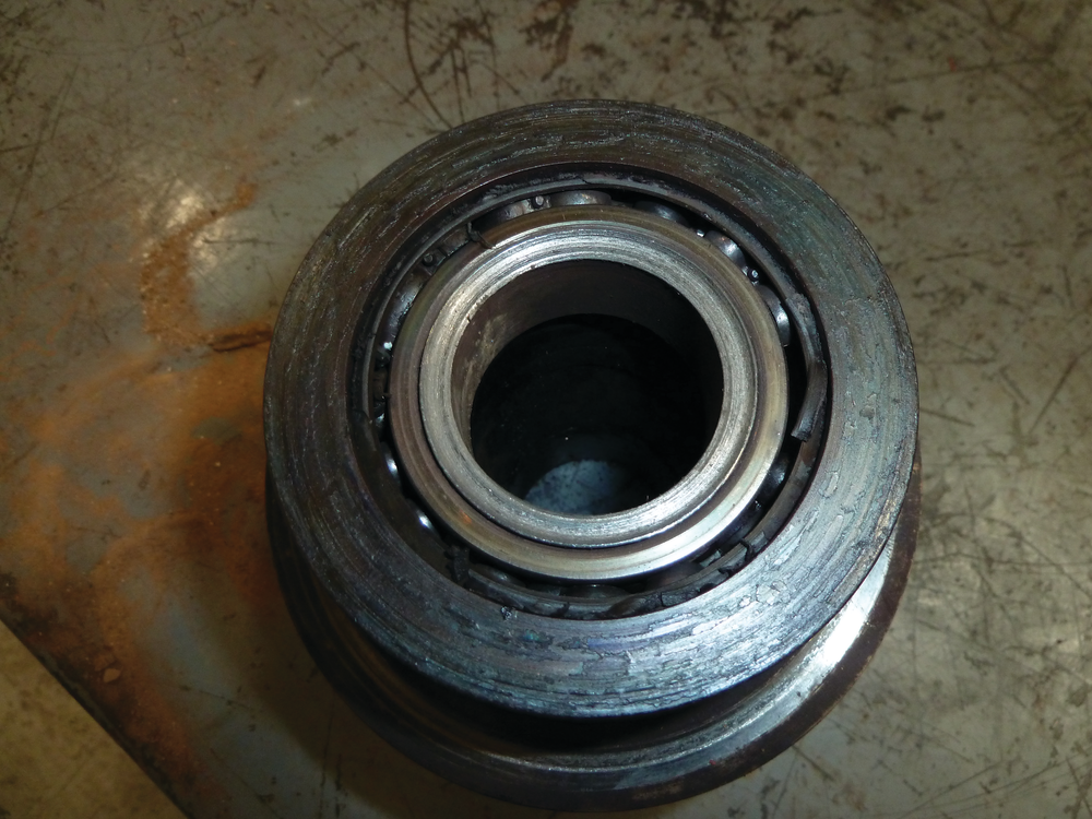 A bearing from a piece of farm equipment on its way to failure due to dirt and lack of viable lubricant.