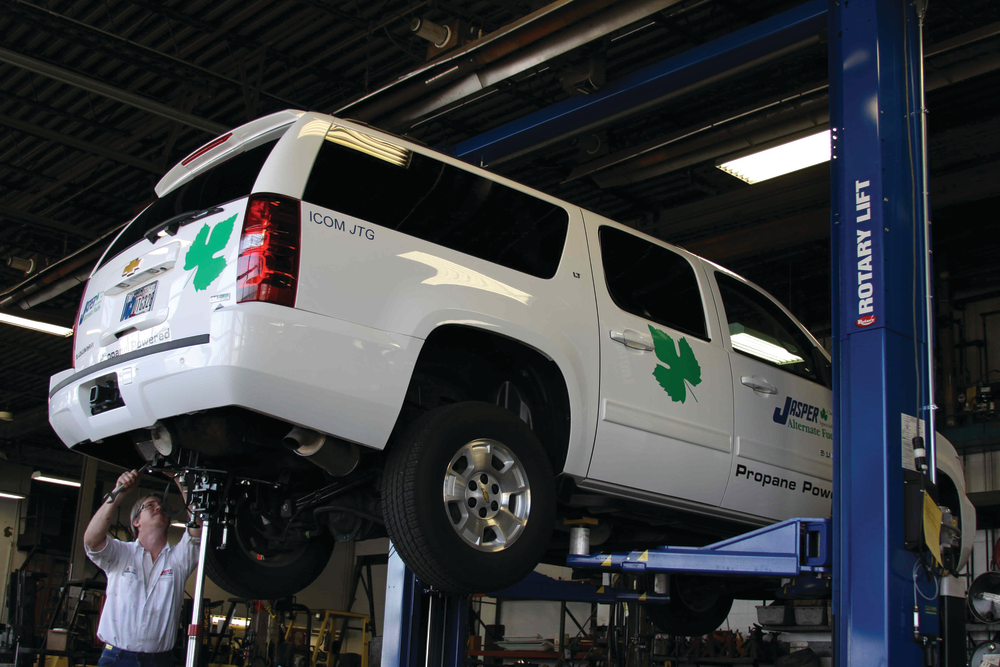 Joe Howell of JASPER Alternate Fuels, a division of JASPER Engines & Transmissions, uses the company's new Rotary Lift SPO18 heavy-duty two-post lift to convert a company truck to run on propane autogas.
