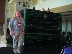 Brooke Colley of Matco Tools shows a green trim toolbox at the tool storage area. Brooke Colley of Matco Tools shows a green trim toolbox at the tool storage area.