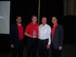 John Castelino, left, Don Guillard, third from left, and Brett Shaw, right, of Mac Tools honor Kirk Clore of Clore Automotive for the best new product of the year. John Castelino, left, Don Guillard, third from left, and Brett Shaw, right, of Mac Tools honor Kirk Clore of Clore Automotive for the best new product of the year.