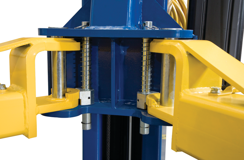 Swing arm lifts employ restraint devices to prevent arms from shifting or dislodging after a vehicle is already mounted and raised.