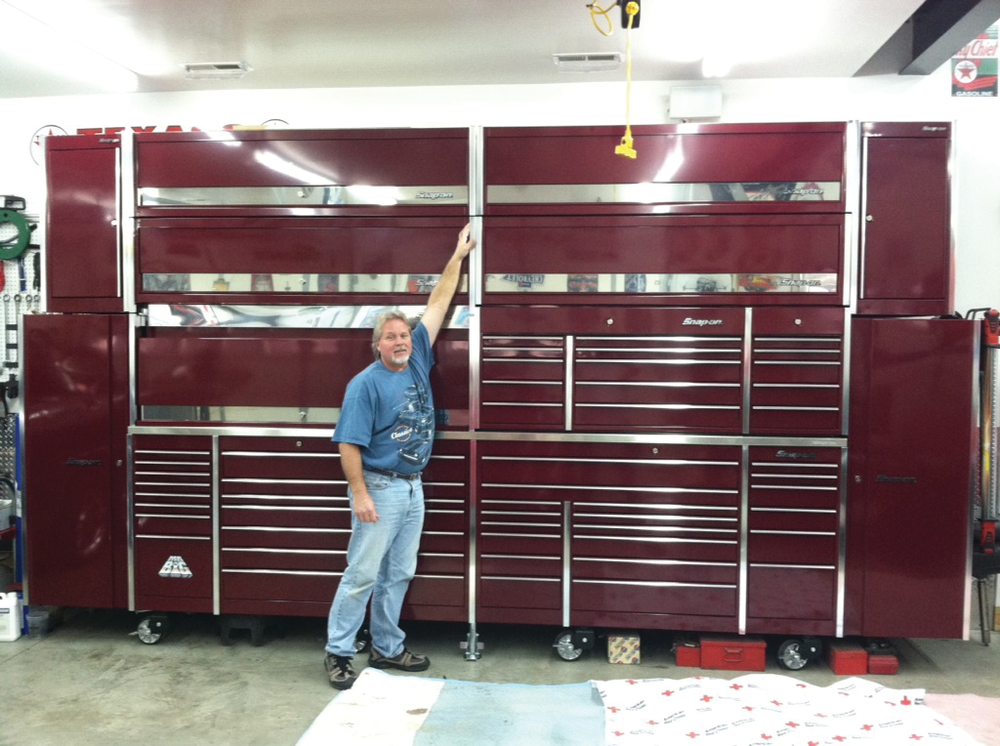 Brian Hall's can't reach the top of the massive toolbox.