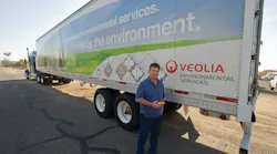 Electronics Recycling Division's fleet manager Michael Bomgardner holds the Zonar 2010 inspection tool which his drivers use as an electronic vehicle inspection reporting solution for pre- and post-trip inspections.