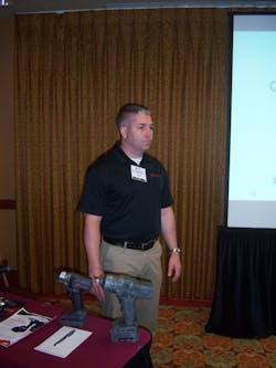 Andy Mandel of Ingersoll Rand answers questions about cordless power technology during the Ace Tool Co. national dealer expo in St. Petersburg, Fla. Andy Mandel of Ingersoll Rand answers questions about cordless power technology during the Ace Tool Co. national dealer expo in St. Petersburg, Fla.