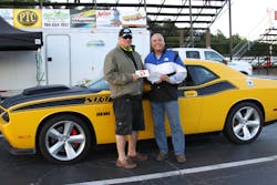 ALI President R.W. 'Bob' O'Gorman presents the trophy for 2013 Spring Fling Drag Race Experience Bracket Race Winner to Robert Moore. ALI President R.W. 'Bob' O'Gorman presents the trophy for 2013 Spring Fling Drag Race Experience Bracket Race Winner to Robert Moore.