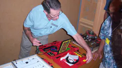 Jaime Lazarus demonstrates the capabilities of Power Probe tools during the ISN show in Orlando, Fla.