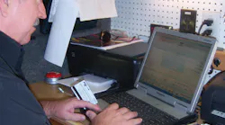 Bill Jaynes rings up a sale using a customer's credit card.