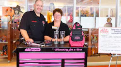 Tom Seagraves congratulates toolbox winner Julie Deering.