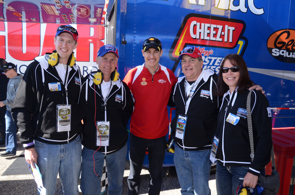 Penske racing driver Joey Logano, center, welcomes, at left, Dylan Larson, Lonny Larson, Mike Murphy and Misty Edwards.