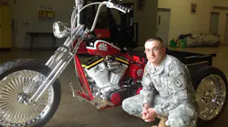 Donovan Finch receives his winning trike for Mac Tools 75th anniversary.
