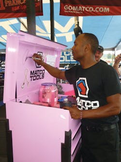 Matco Tools dragster Antron Brown signs the pink Matco Toolbox that was a raffle prize in a fund raiser for breast cancer awareness. Matco Tools dragster Antron Brown signs the pink Matco Toolbox that was a raffle prize in a fund raiser for breast cancer awareness.
