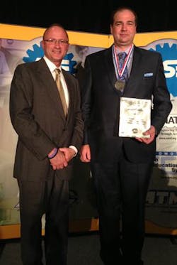 Greg Clayton of Cengage Learning honors Joseph Tuholski as the Cengage Learning/ASE Tech of the Year. Greg Clayton of Cengage Learning honors Joseph Tuholski as the Cengage Learning/ASE Tech of the Year.