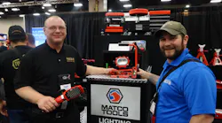 Steve Bailey, left, of SFA Companies, Inc. presents the 10W COB aluminum cordless light to Nick Bowden of Watertown, S.D.