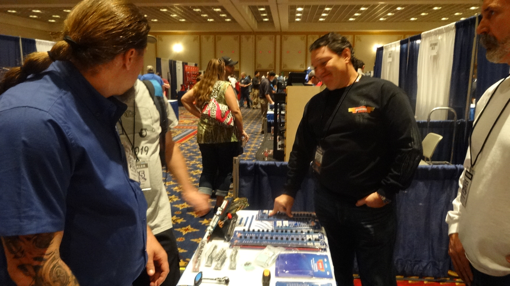 Dealers examine hex bits and sets at the Durston Manufacturing/VIM Tools booth.
