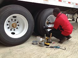 A Velociti technician doing an install of an Advantage PressurePro tire pressure monitoring solution. A Velociti technician doing an install of an Advantage PressurePro tire pressure monitoring solution.