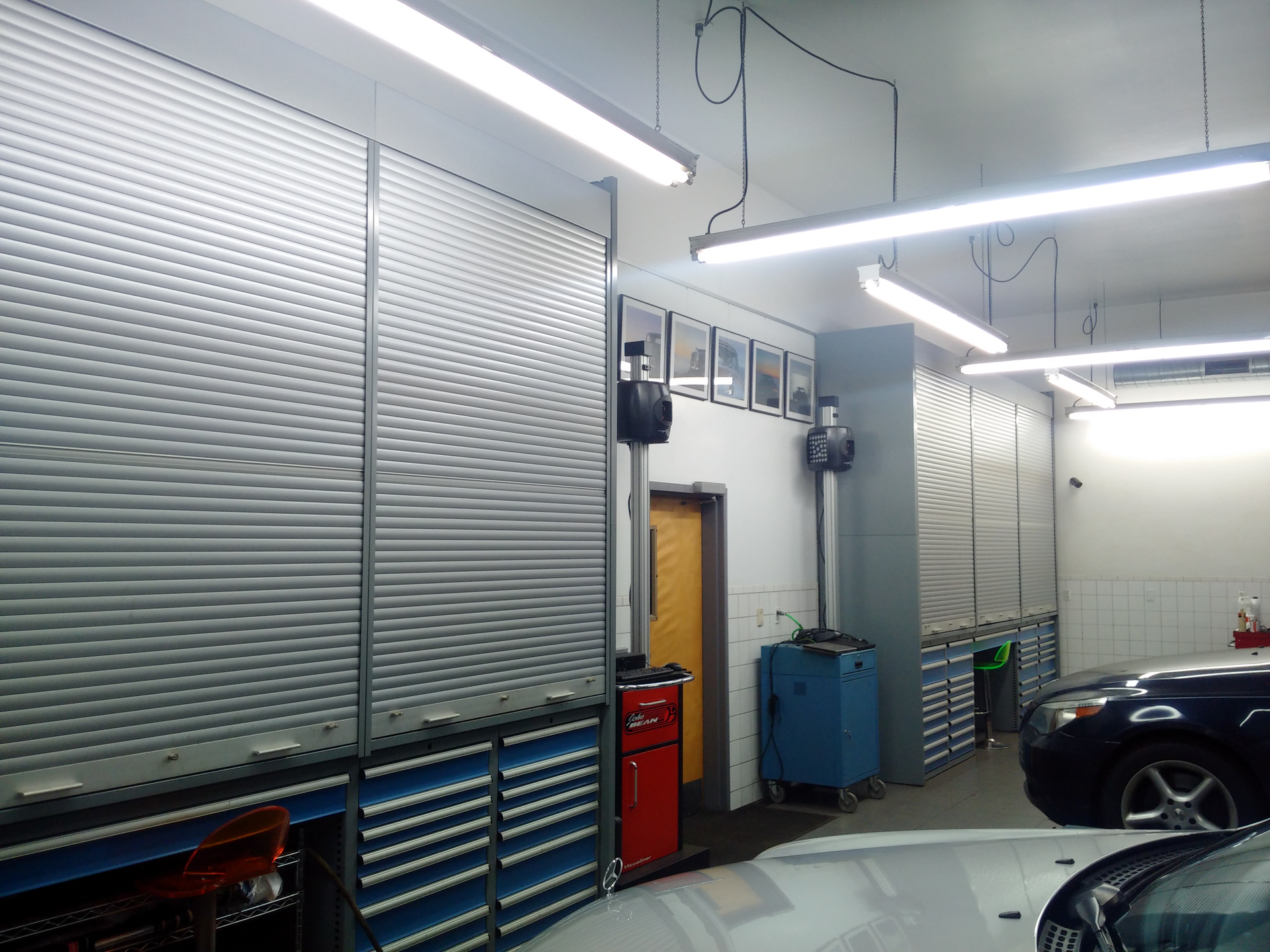 AlphaCars and Ural of New England custom-designed its streamlined-looking shop space so the entire front wall of the service bays is a large storage wall with integrated workbench, toolbox and storage.