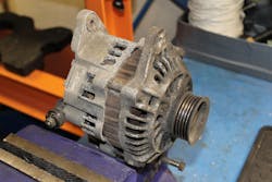 An alternator, removed from a vehicle. An alternator, removed from a vehicle.