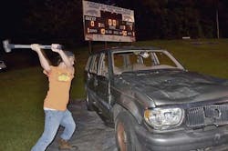 Seth Dalton, a student of the Skills program at South Campus, lets loose with a hammer at a football game in fall 2014. Seth Dalton, a student of the Skills program at South Campus, lets loose with a hammer at a football game in fall 2014.
