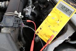 Using needle back probes to measure mass air flow sensor supply voltage live. Using needle back probes to measure mass air flow sensor supply voltage live.