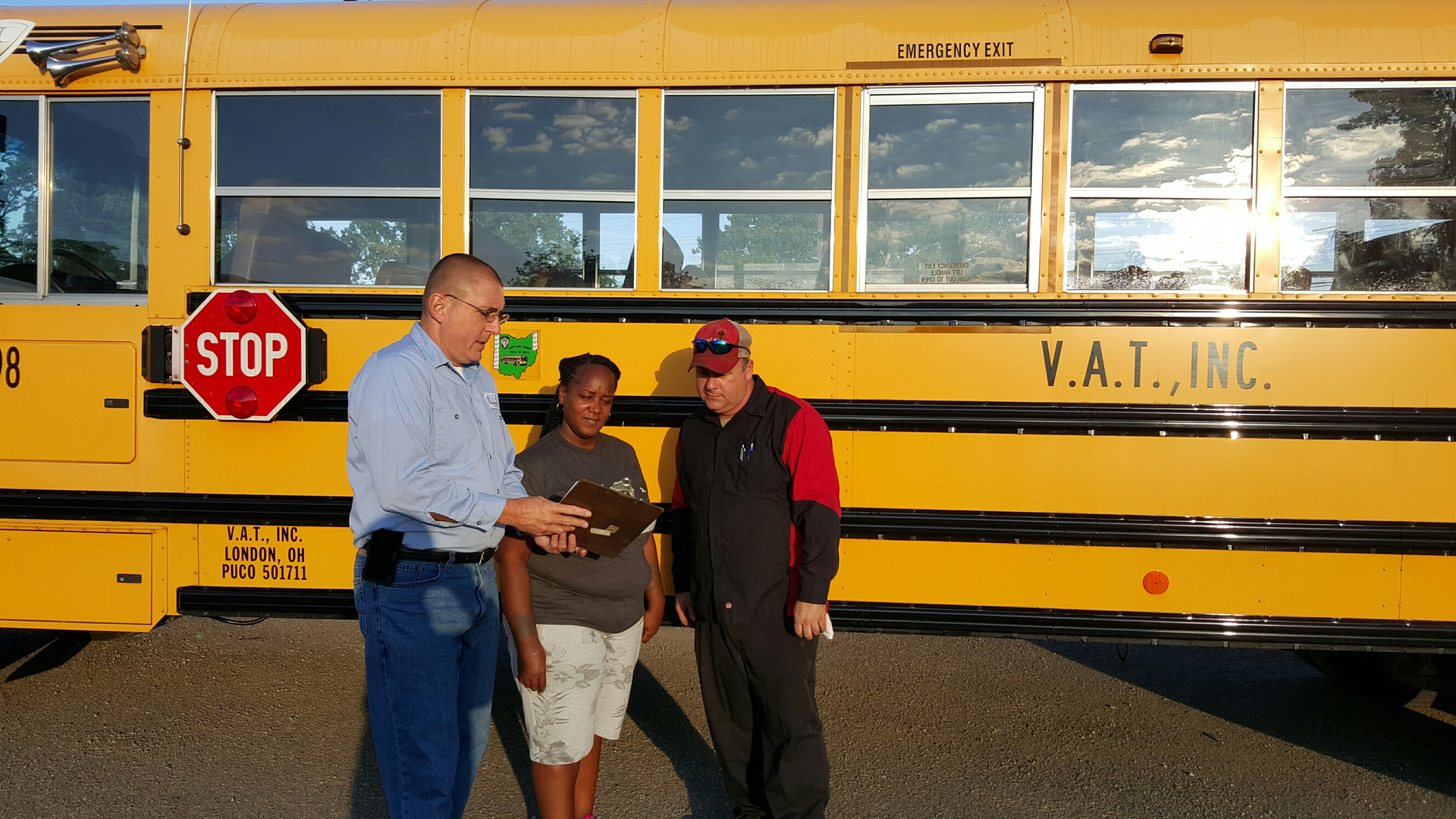 Caption: Williams (pictured left) stands with driver/trainer Cheri Butts (middle) and Brian Hamlin, head technician (right). Photo courtesy of Tracy Williams, safety director, V.A.T. Inc.