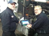Paul Schmitt (left) used the Bosch Esitronic Truck to work on a customer&apos;s Peterbilt with a Cummins N14 Plus to find a faulty water pump that was causing the truck to shut off.