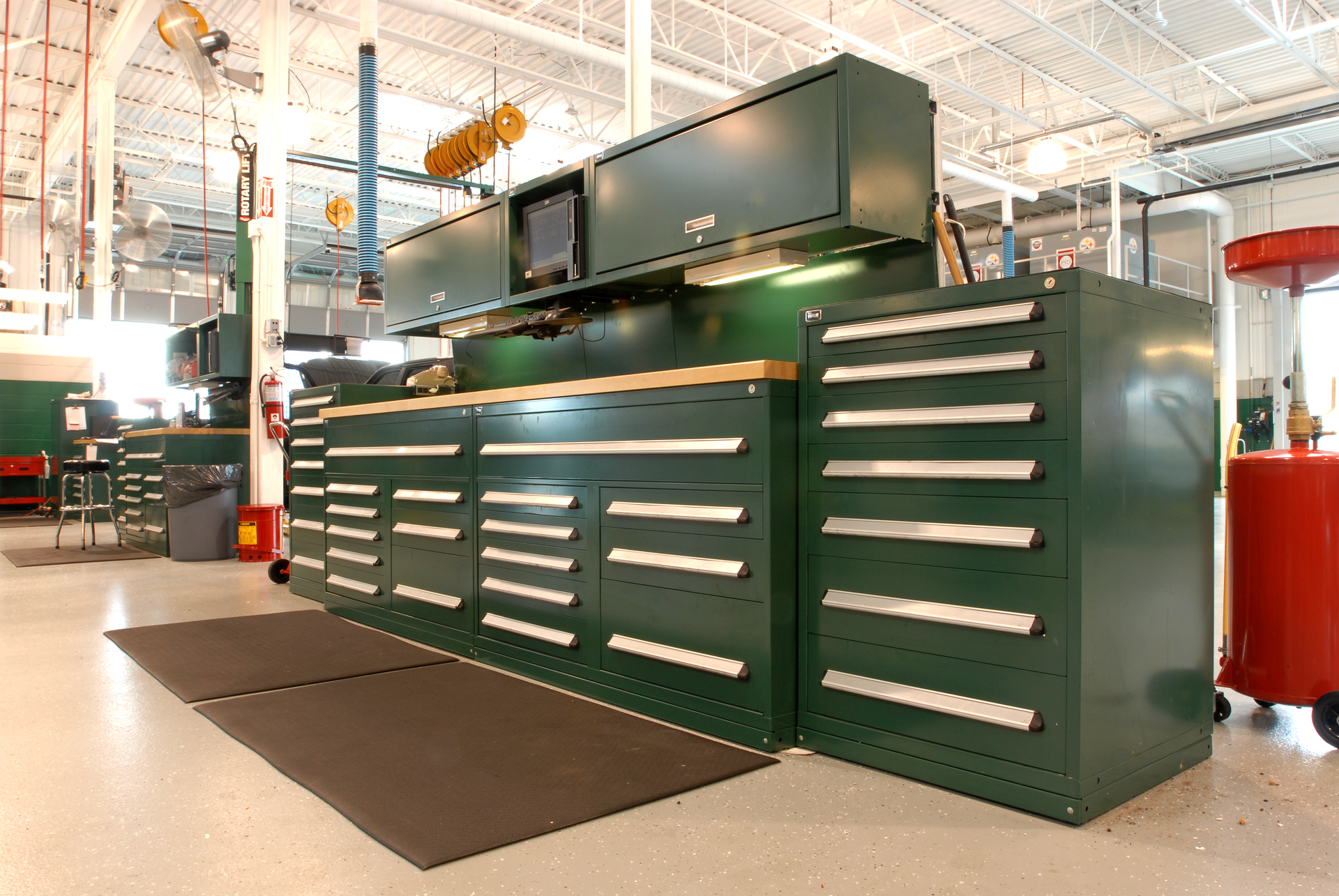 Vidmar's 'Rotunda' inventory control system consists of four Vidmar cabinets with a total of 52 tool drawers, plus overhead cabinets for bulk storage.