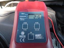 Fig. 2: After the customer had an opportunity to drive the trailer for a period of time to duplicate the original conditions, the amp draw test was repeated and showed a 2-amp draw. Using the Amp Hound 2 on the individual fuses in the underhood fuse box, we found the fuse to the trailer brake relay/controller (fuse 6) was drawing current. We also noted the trailer running lamp fuse was blown again. To confirm we were on the right path of our diagnosis, we disconnected the trailer connector and still had a 2-amp draw. Fig. 2: After the customer had an opportunity to drive the trailer for a period of time to duplicate the original conditions, the amp draw test was repeated and showed a 2-amp draw. Using the Amp Hound 2 on the individual fuses in the underhood fuse box, we found the fuse to the trailer brake relay/controller (fuse 6) was drawing current. We also noted the trailer running lamp fuse was blown again. To confirm we were on the right path of our diagnosis, we disconnected the trailer connector and still had a 2-amp draw.