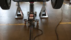 A floor jack is only a lifting device. Until the appropriate support stands are placed under an OEM-recommended lifting point, it is not safe for a technician to go under the vehicle.