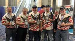 A group of tool dealers show off their Cornwell 'We Do' themed buttons, during the 2017 Cornwell Tools National Rally.