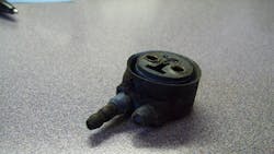 A corroded lamp connector shows signs of environmental stress and systemic corrosion. A corroded lamp connector shows signs of environmental stress and systemic corrosion.