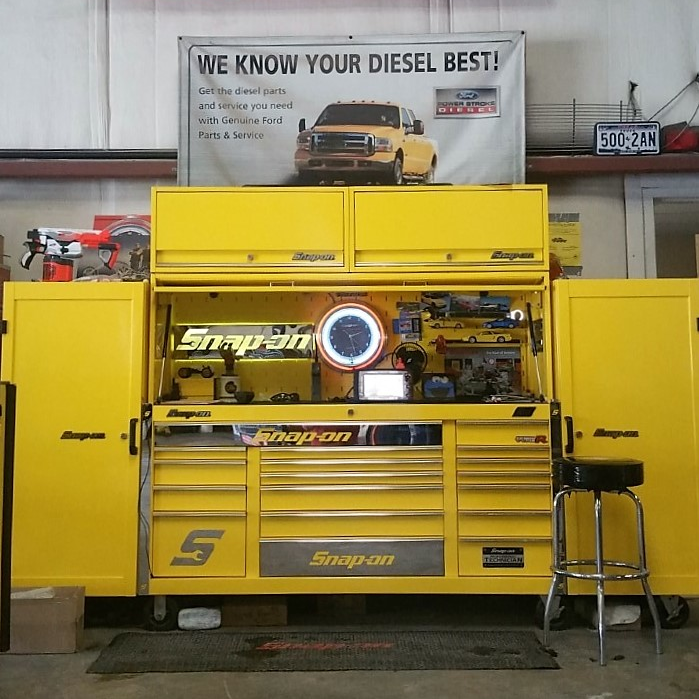 This bold yellow 124' Snap-on tool set up features a Snap-on Classic Series main box, two side lockers and a hutch.