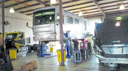 Among the factors to keep in mind when selecting a vehicle lift are the size, height and layout of the shop.