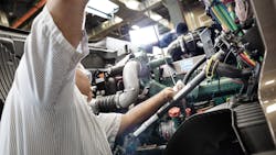 One benefit of cleaner burning diesel engines is less soot output. Here, a technician works on a Volvo D11 engine. One benefit of cleaner burning diesel engines is less soot output. Here, a technician works on a Volvo D11 engine.