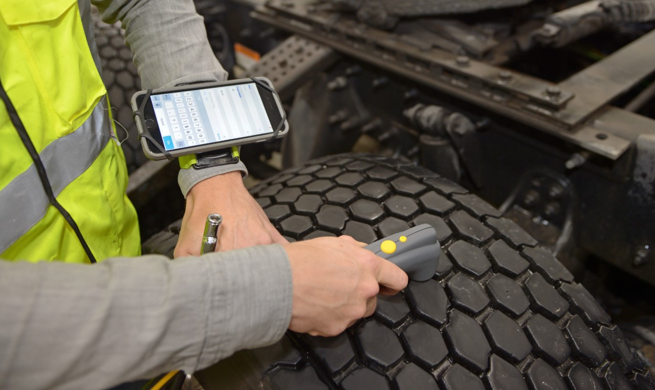 Trained Goodyear truck tire technicians use a special scanning device to electronically record air pressure and tread depth.