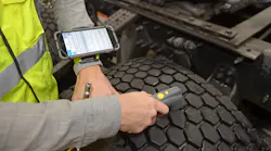Trained Goodyear truck tire technicians use a special scanning device to electronically record air pressure and tread depth.