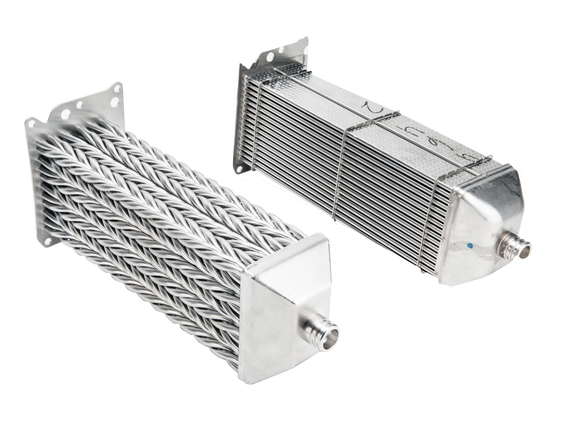 An H-Core EGR cooler produced by BulletProof Diesel shown on the left, demonstrating the exhaust tubes arranged in a helical pattern that resembles a braid. A conventional EGR cooler is shown on the right.