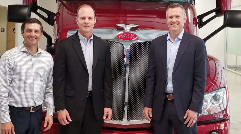 (Left to right) Jake Monetero, Paccar Innovation Center general manager; Scott Newhouse, Peterbilt chief engineer; and Jason Koog, Peterbilt general manager, pose with a Peterbilt at the Paccar Innovation Center in Sunnyvale, Calif.