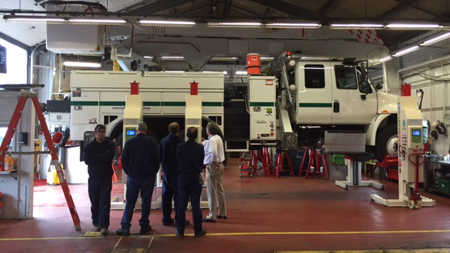 Image 1 Individuals Around Truck