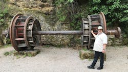 On-location in Croatia, Levitt stands in front of the hydro turbine rotor used in the first AC generator to light a city. On August 28, 1895, the twin 550 KW generators were spun up and lighted the streets of Sibenik, Croatia for the first time. On-location in Croatia, Levitt stands in front of the hydro turbine rotor used in the first AC generator to light a city. On August 28, 1895, the twin 550 KW generators were spun up and lighted the streets of Sibenik, Croatia for the first time.