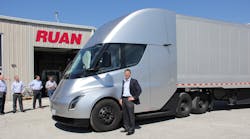 Ruan CEO Ben McLean with Tesla's wholly electrically powered tractor. Ruan CEO Ben McLean with Tesla's wholly electrically powered tractor.